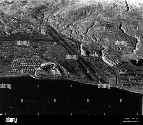 A photograph of the U.S. Navy base at Adak, Alaska, showing military ...