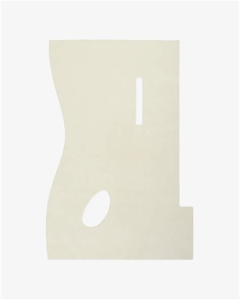 A white woolen hand tufted carpet with a simple geometric pattern.