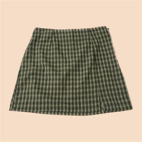 Green plaid mini skirt. Worn once, has a zipper in... - Depop
