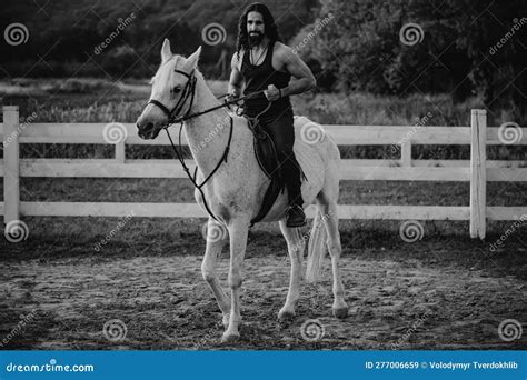 Young Man Riding a Horse. Handsome Macho Cowboy Riding on a Horse ...