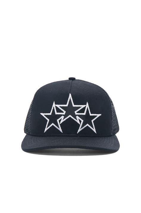 Amiri Star Trucker Hat in Black | FWRD