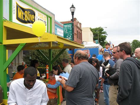a group of people standing around each other in front of a mcdonald's ...