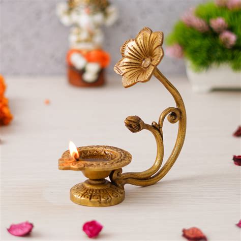 eCraftIndia Golden Decorative Brass Diya with Flower Handle