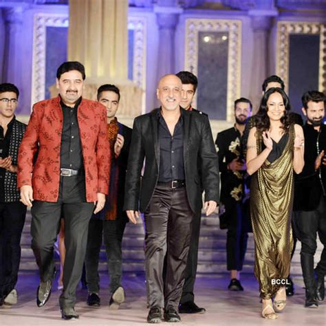 A participant walks the ramp during a fundraiser fashion show organised ...