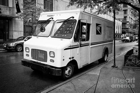 U.S. Postal Service (USPS) trucks are parked at a post office on August 23, 2024 in Glendale, Califo
