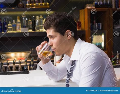 Young Man Drinking Whiskey Neat Stock Photo - Image of alcohol ...