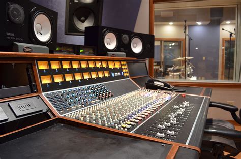 an audio mixing console in a recording studio