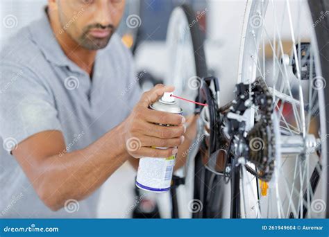 Man Oiling Bicycle Chain and Gear with Oil Spray Stock Photo - Image of copy, professional ...
