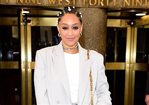Tia Mowry Wore An All-Gray Outfit Accessorized With Hair Shells—See Pics | Glamour