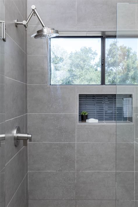 Gray Tile Shower Design with Window and Accent Tiles | Grey bathroom ...