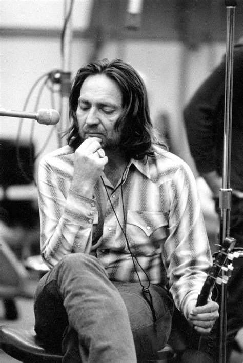A young Willie Nelson lost in thought in the recording studio at Muscle ...