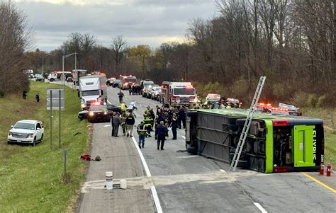 1 of 28 passengers in I-490 tour bus crash dies