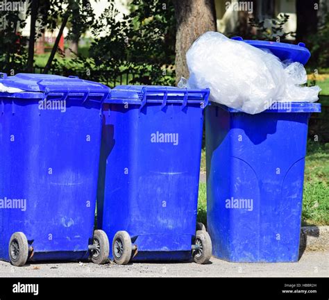 Wheeled garbage cans on the street Stock Photo - Alamy