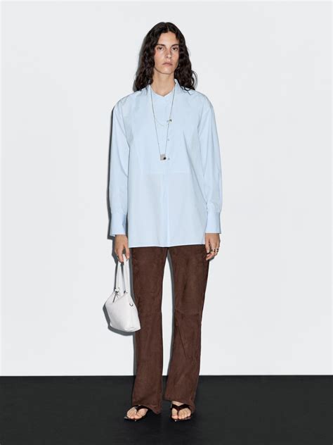 Shirt with stand collar and bib