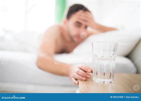 Handsome Man Wake Up with Head Pain Suffers from Headache and Extend To Get a Glass of Water in ...