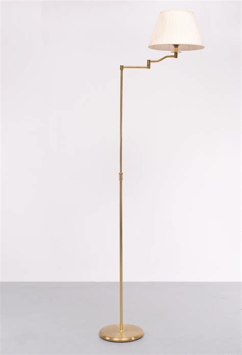 Brass swing arm floor lamp 1970s Germany For Sale at 1stDibs