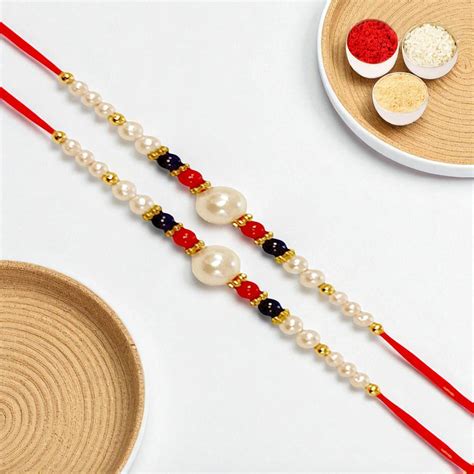 Rakhis Online UK-Set of 2 - ABC-22 Pearl Beads Rakhi – Ghasitaram Gifts