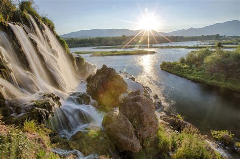 Sunlight and majestic waterfalls on the snake river in Idaho image ...