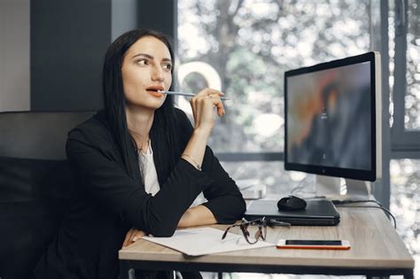 Lady with glasses. manager is sitting at the computer. businesswoman ...