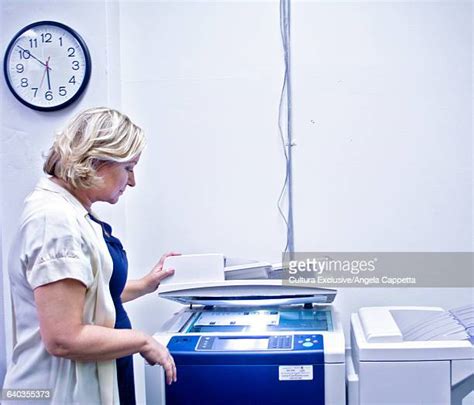 Woman Using Copy Machine 的图像结果