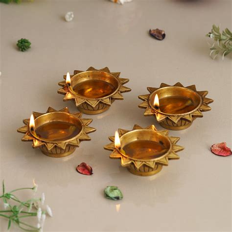 eCraftIndia Set of 4 Golden Sun Shaped Decorative Brass Diyas