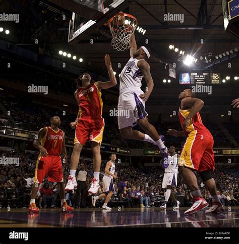 DeMarcus Cousins of the Sacramento Kings dunks a ball off an offensive ...