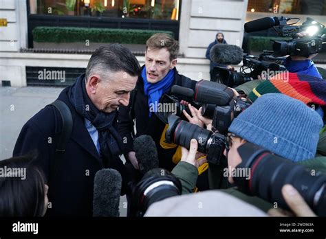 Fujitsu's European boss Paul Patterson (right) is surrounded by media ...