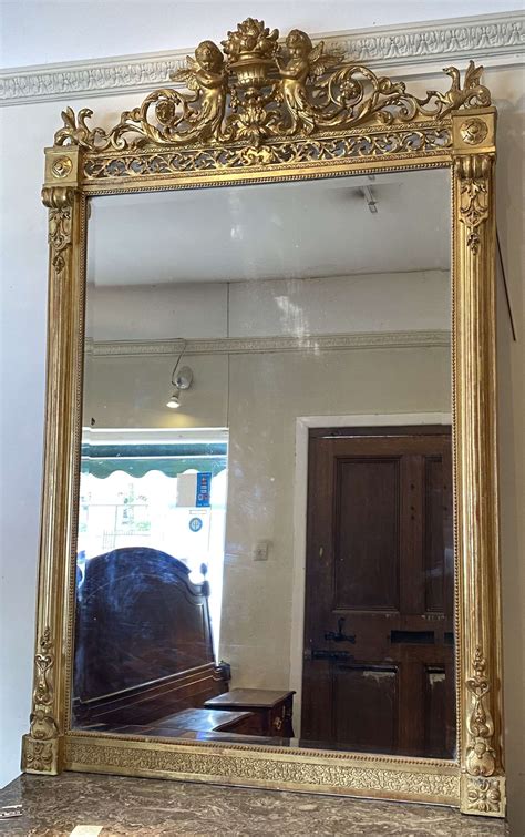 Large 19th Century gilt mirror with cherubs in Antique Floor Mirrors