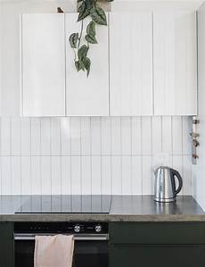 This elegant kitchen makes a strong case for dark green cabinets