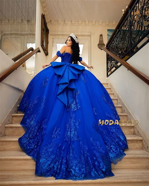 Winter wonderland themed royal blue quince dress with long train and big bow… | Quinceanera ...