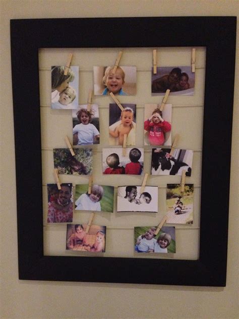My new photo collage frame! Old frame, some rope to hang the pics on and pegs to keep the pics ...