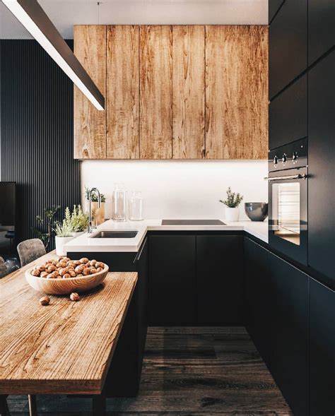Black and wood is the perfect combination of kitchen materials 👌 by ...