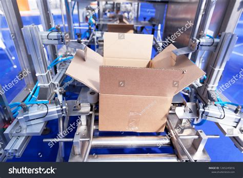 Image result for Automated Cardboard Box Assembly Machine