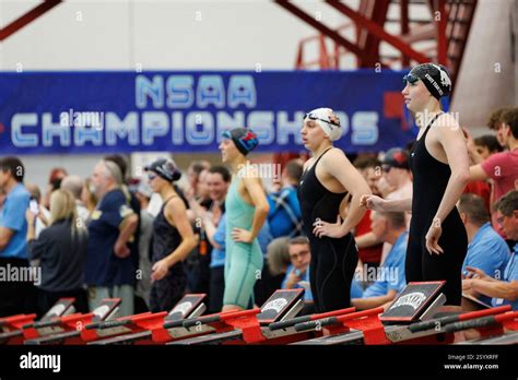 Millard North's Leah Inman, right, gets ready with other swimmers to ...