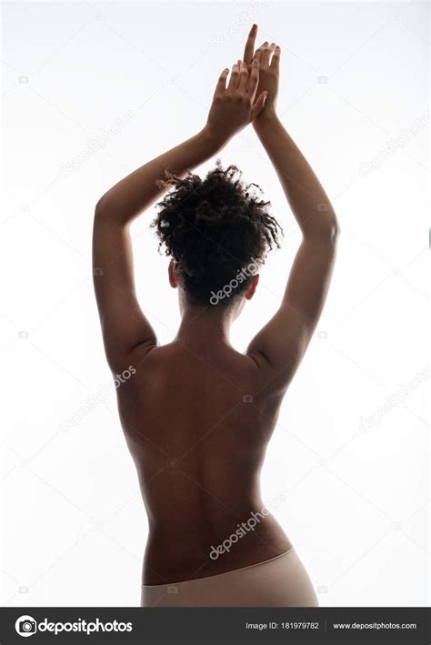 Undressed serene woman raising her arms up Stock Photo by ©iakovenko123 ...
