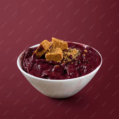 Premium Photo | Frozen acai berry with pacoca isolated on purple background