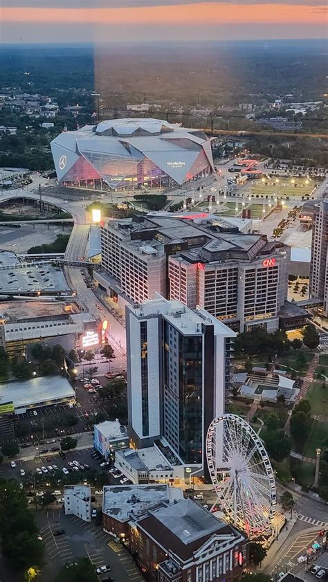 The City Skyline at Sunset with Mercedes-Benz Stadium, the SkyView ...