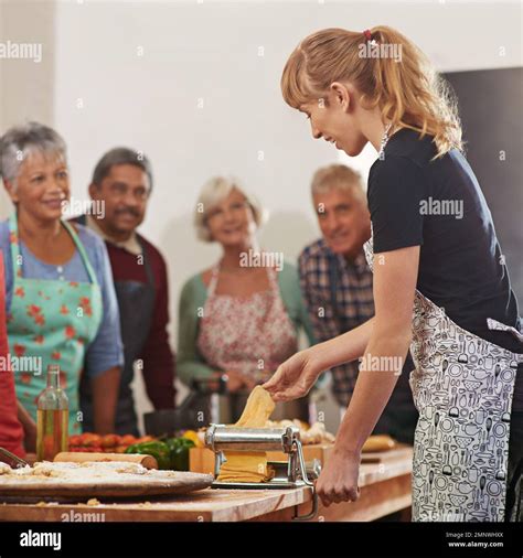 Showing them how to trim their grocery bill. a woman showing her class ...