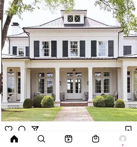 White colonial-style house with black shutters. Unwrap the secrets of ...