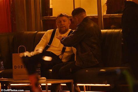 Tom Hardy joins Guy Ritchie for a glass of wine as they take a break ...