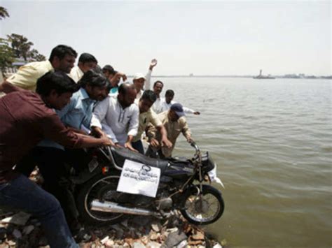 TDP activists throw a motorcycle into the Sagar lake - Snapshot of ...