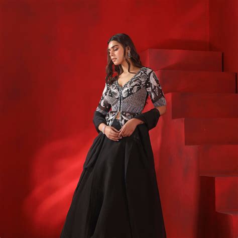 Black magnolia embroidered jacket and lehenga set – Isha Gupta Tayal
