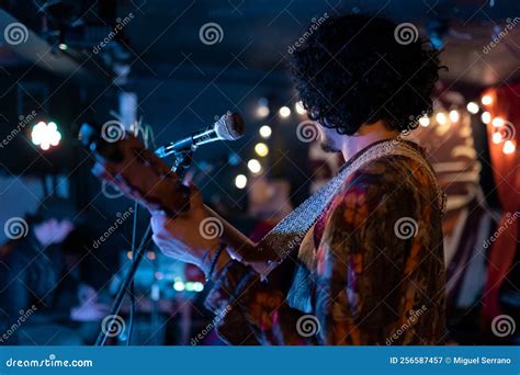 A Young Mexican Musician is Singing and Playing Jarana Guitar during a Live Concert Stock Image ...