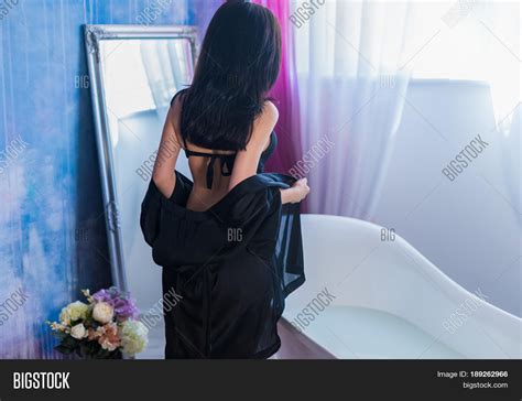 Sexy Brunette Woman Taking Off Her Image & Photo | Bigstock