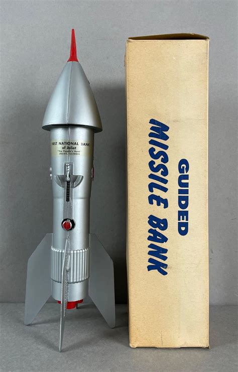 At Auction: Vintage Astro Mfg. Die-Cast Guided Missile Bank