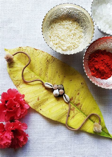 Get Handcrafted Beige & Black Shell Rakhi at ₹ 225 | LBB Shop