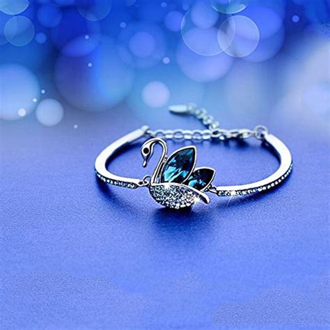 Buy Yellow Chimes Blue Crystal Studded Designer silver toned Swan ...