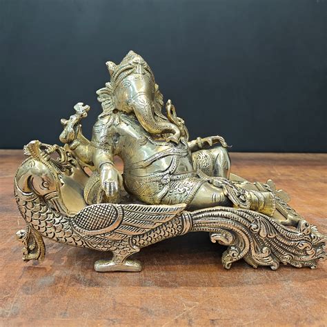 Brass Ganesha Idol Resting On Peacock Singhasan 10 Inch – StatueStudio
