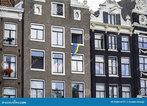 Ukrainian Flag Hanging from a Window in Amsterdam, Netherlands. Typical ...