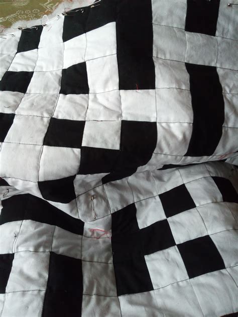 Excuse the wobbly quilting - I want to add a name to this crossword baby quilt, but I'm not sure ...